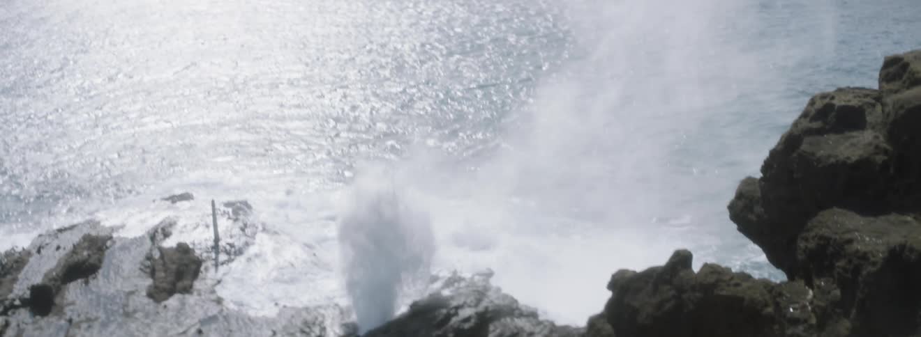 Ocean waves splash up on the rocks