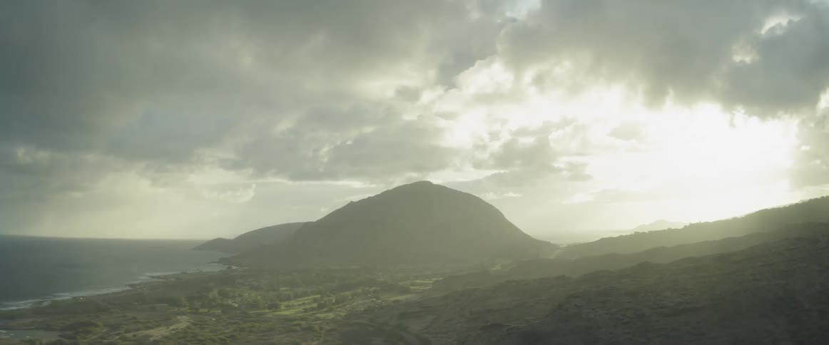 Clouds gather over an island