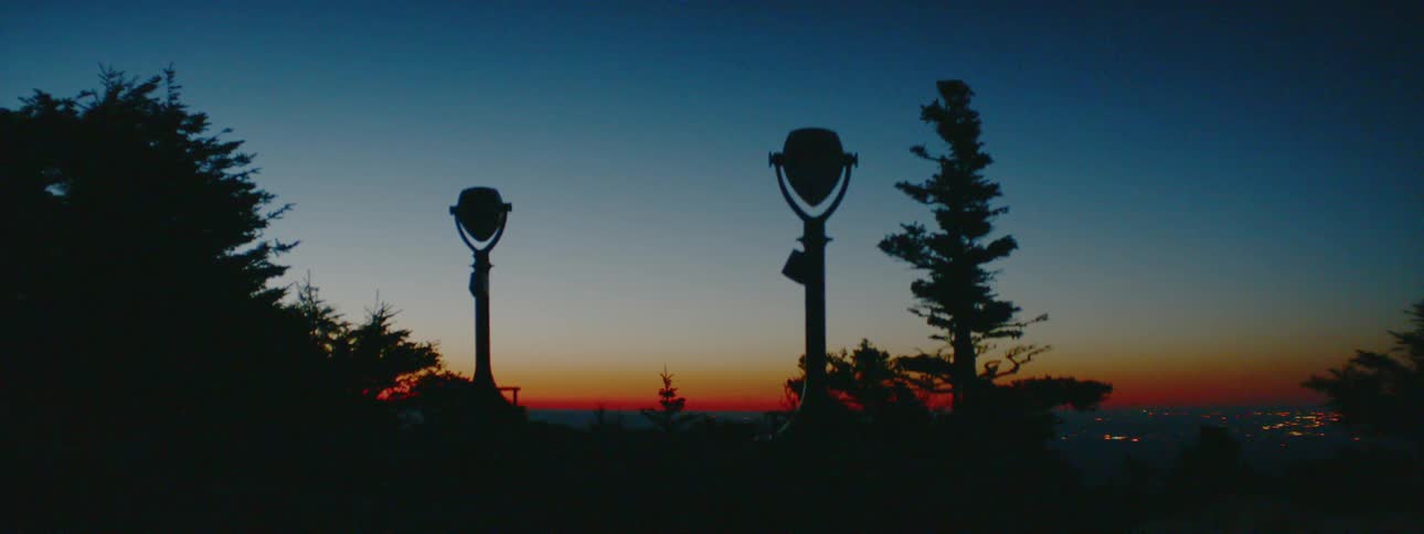 Tower viewers at an overlook at sunset