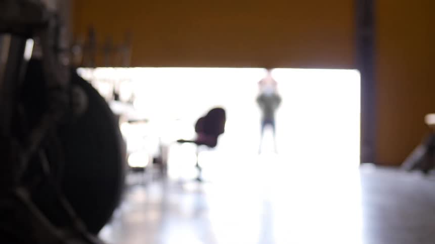 A person opening up a large door