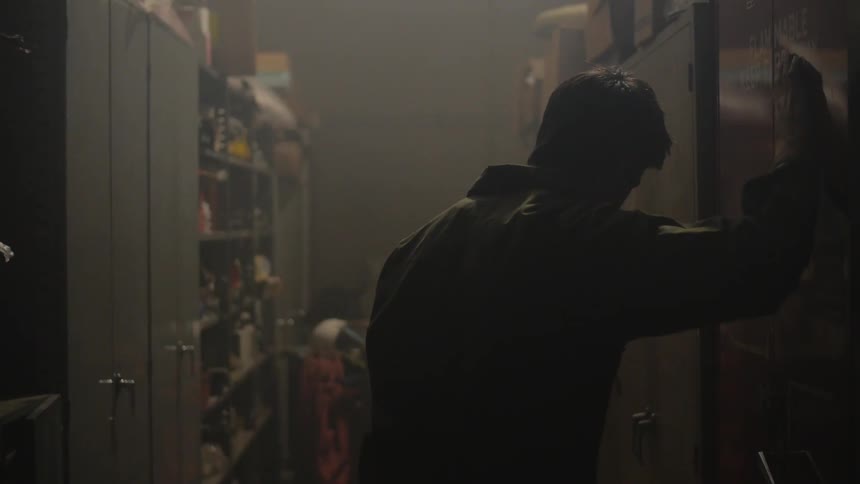 A person inside of a smokey building