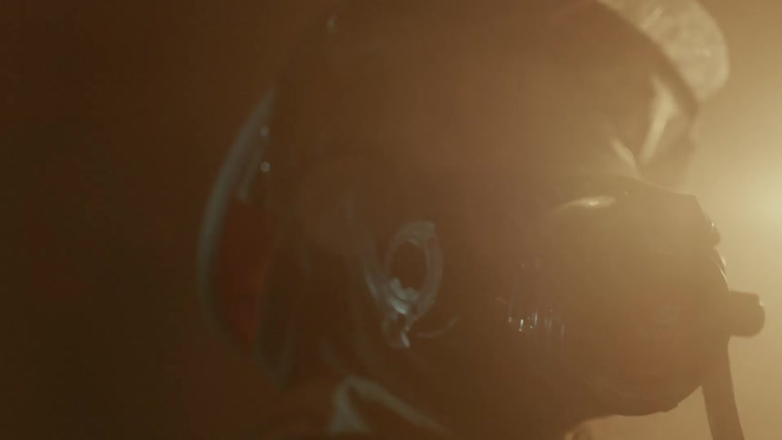 Firefighter looks on at a fire