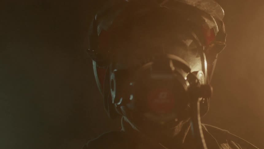 Firefighter looks on at a fire