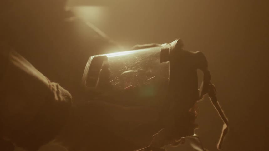 Firefighter holds and examines face mask
