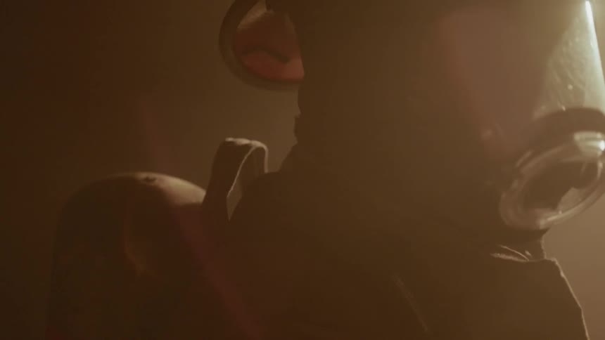 Firefighter looks on at a fire