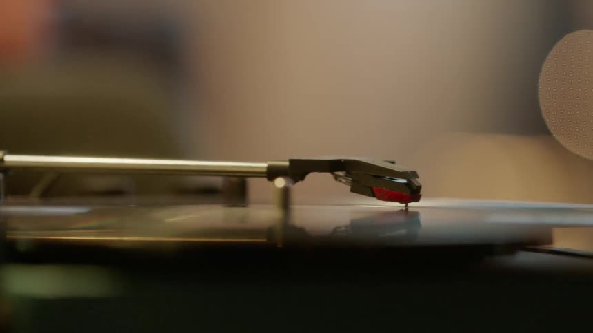 An album spins on a record player