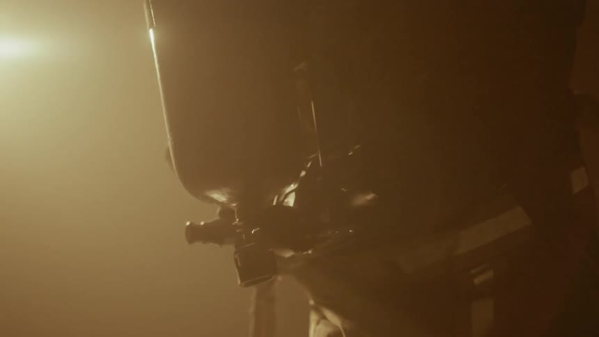A firefighter puts on an oxygen tank