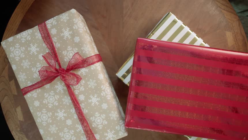 Christmas presents are removed from a table