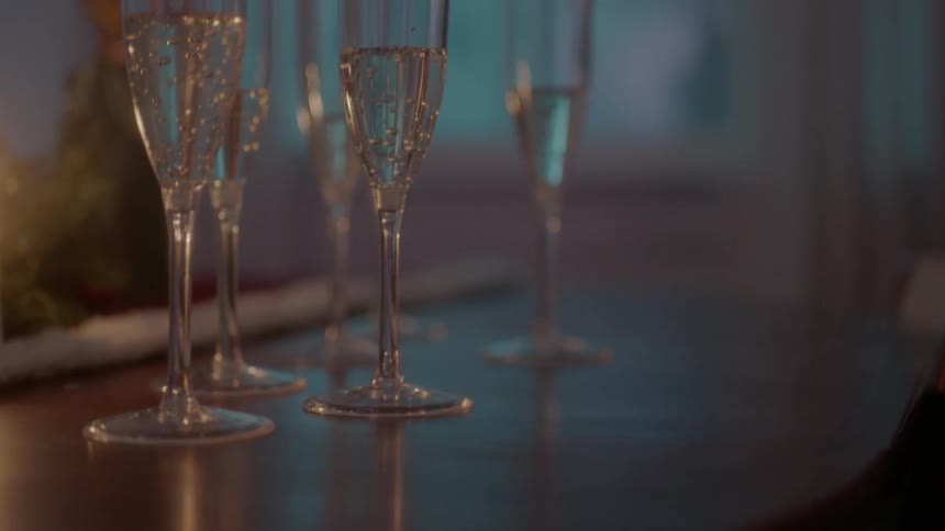Glasses of champagne sit on a table