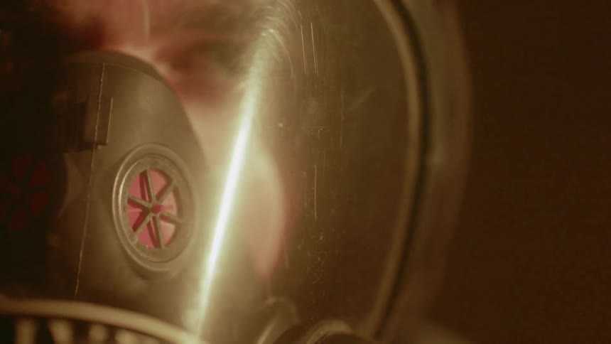 A firefighter wears a mask