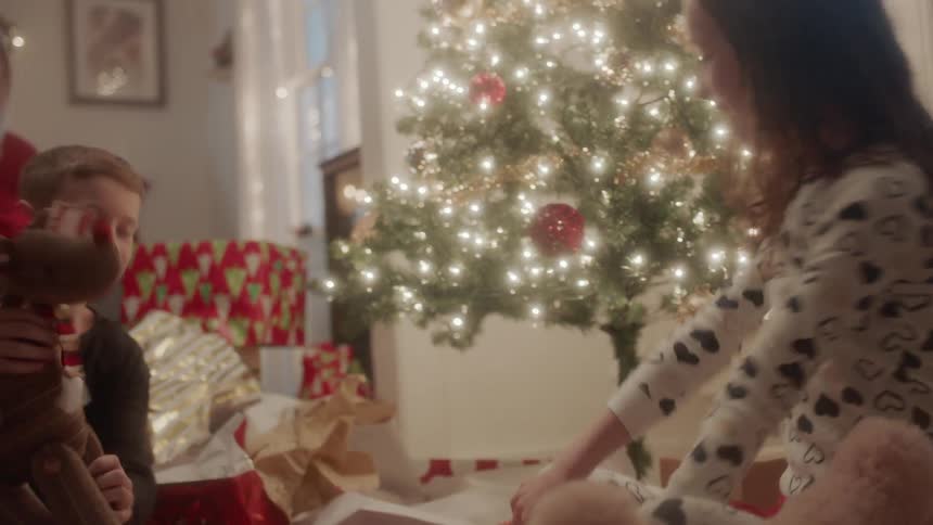A family opens christmas gifts