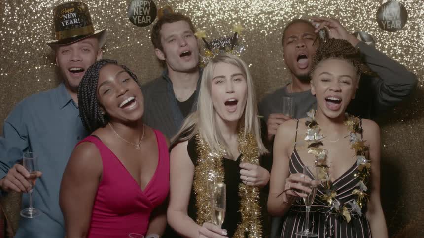 A group of people are counting down to new years and celebrating