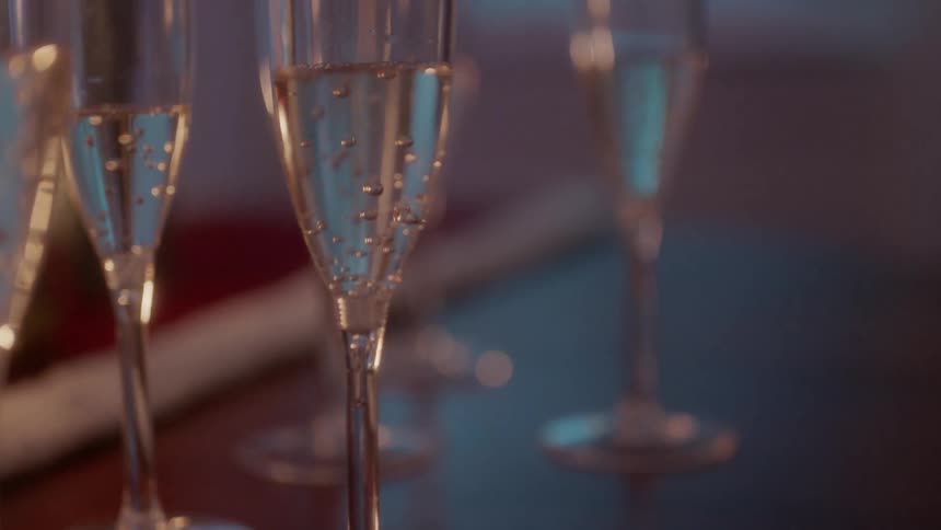 Glasses of champagne sit on a table
