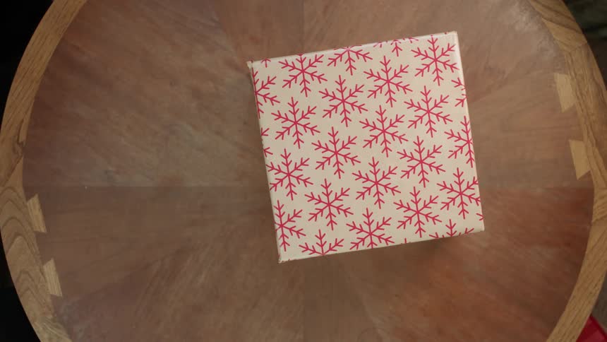A christmas gift is placed on a table