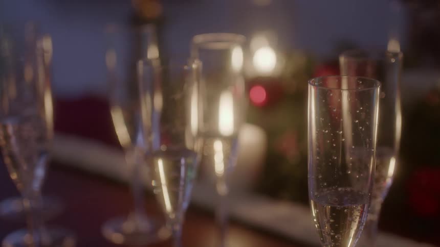 Glasses of champagne sit on a table