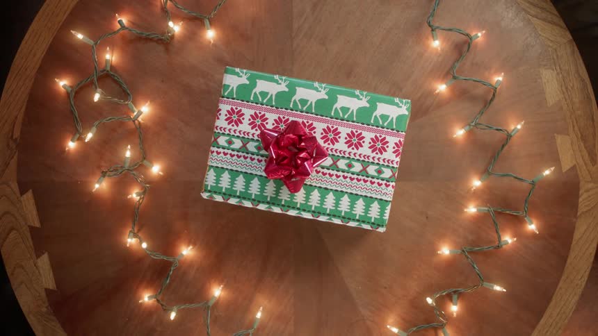 A christmas gift is placed on a table