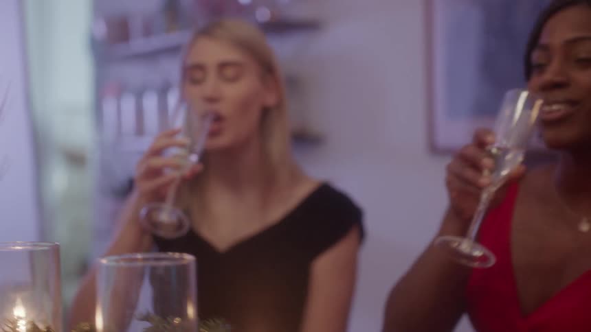 Friends celebrate christmas with glasses of champagne