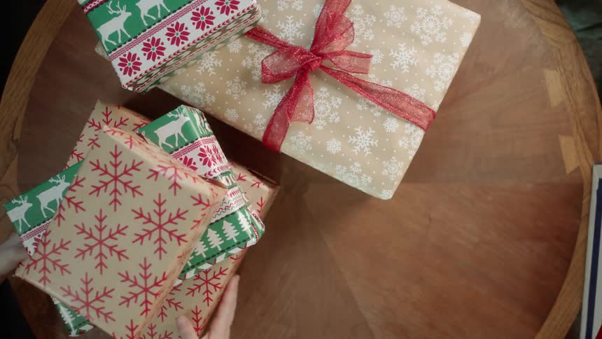 Presents sitting on a table are removed by unseen people