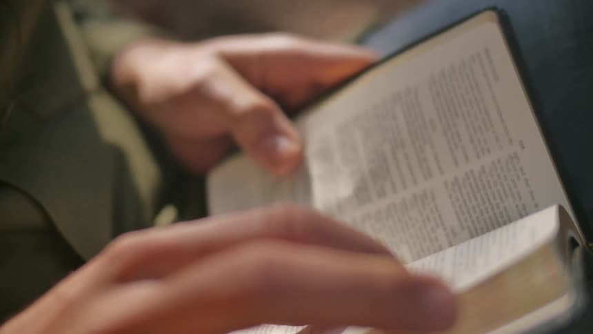 A man is reading the bible