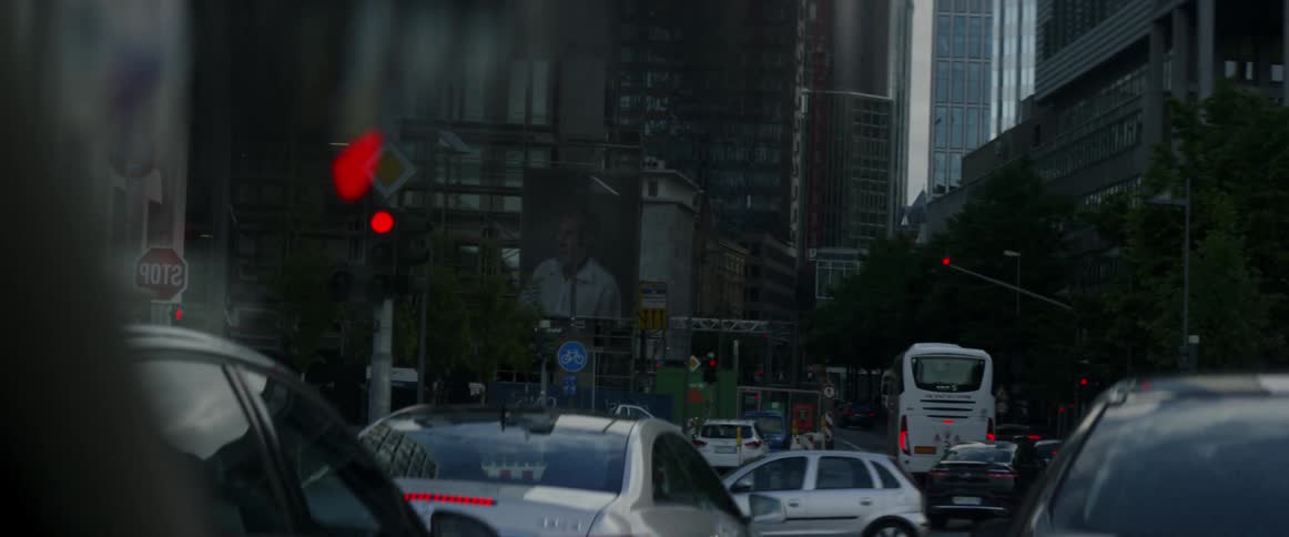 Clouds gather over an busy urban street