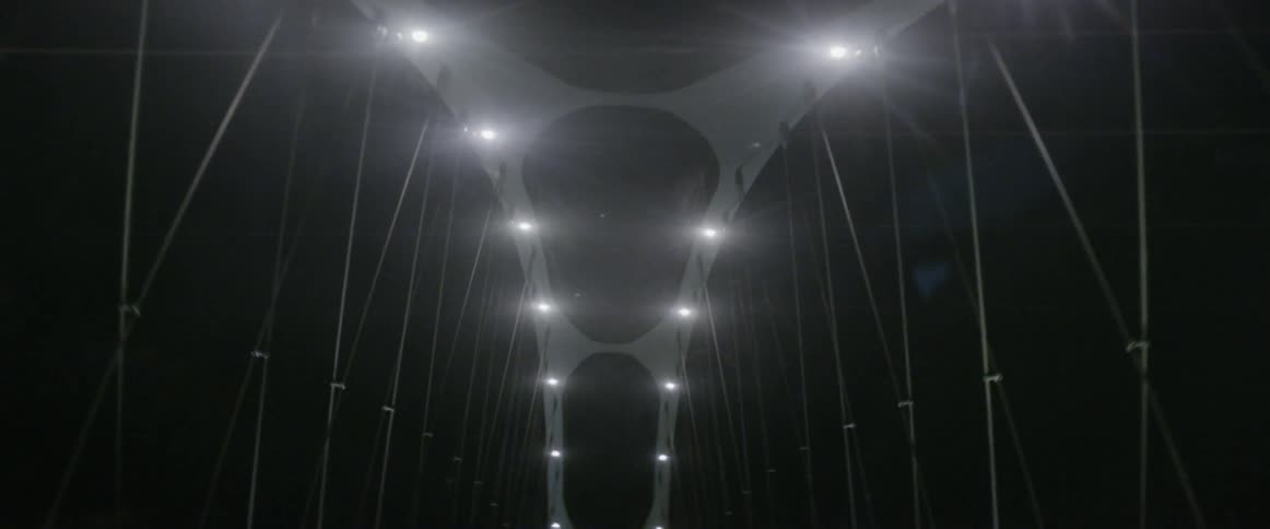Crossing a suspension bridge at night
