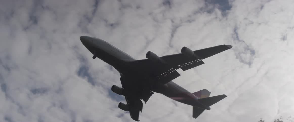 A large plane is flying overhead