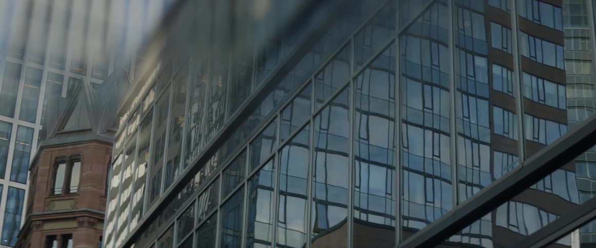 A city building is covered with glass