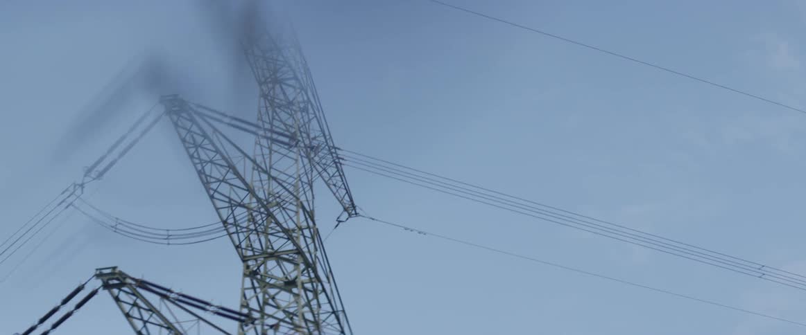 An electrical tower with several levels of power lines