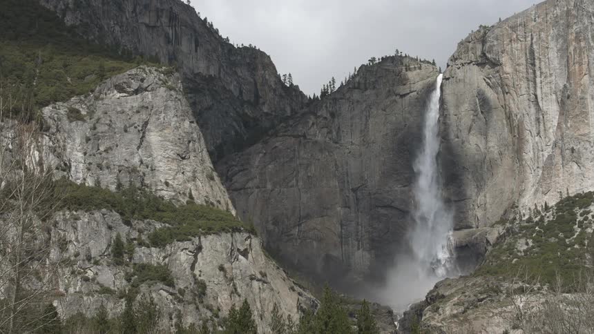 View of some large mountains with a waterfall at the top