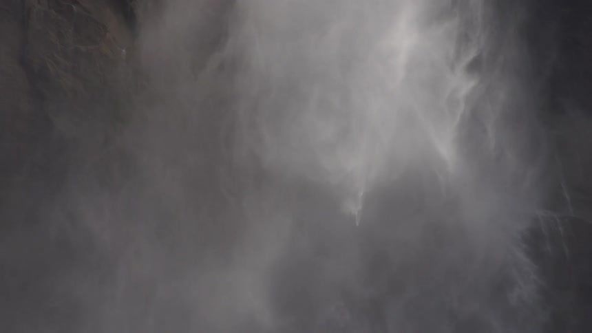 Slow motion view of water falling down from above
