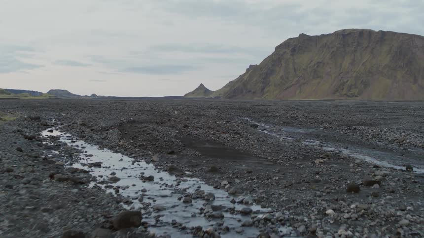 Dirt and rocks cover a rural field