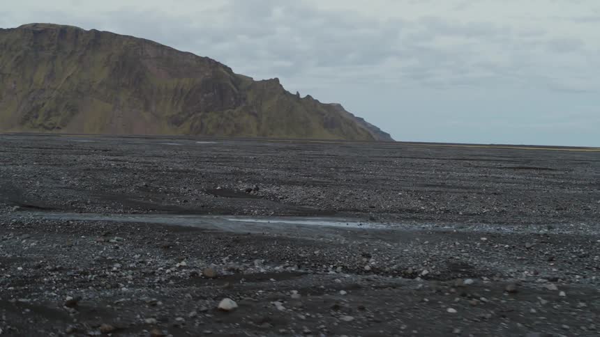 A dirt and rock filled flat land
