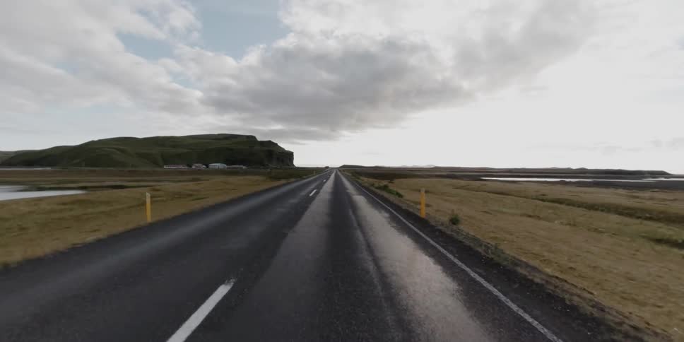 Time lapse of someone driving down a very straight road