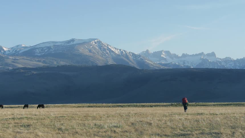 A mountain looms in the distance