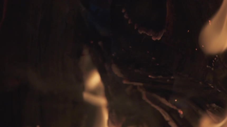 Flames and smoke come from burning wood