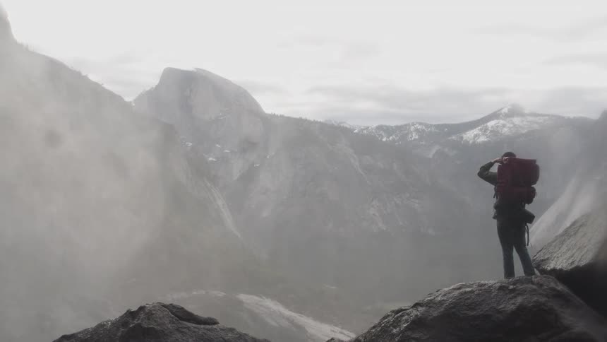 A man is hiking in the mountains