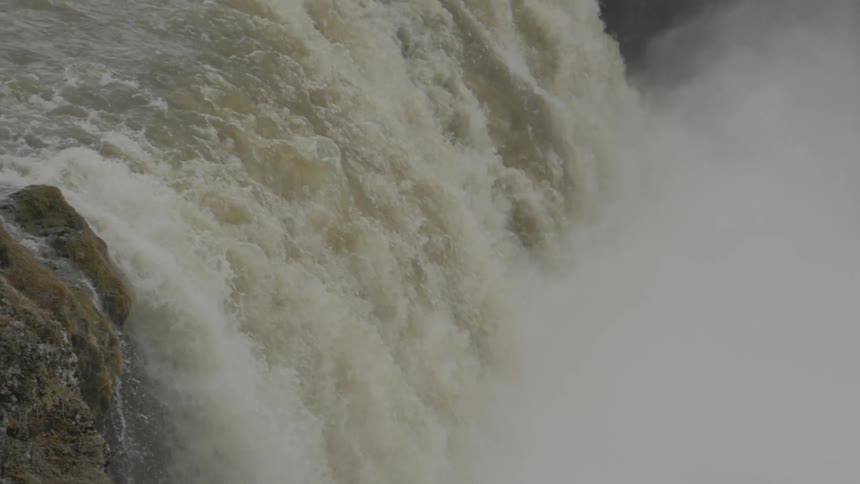 A waterfall rolling down a cliff side