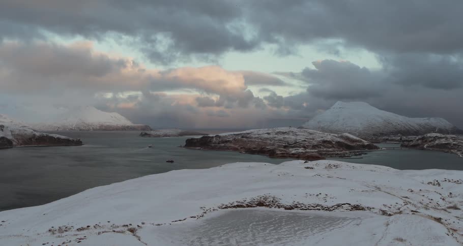 Snowy mountains surround the sea
