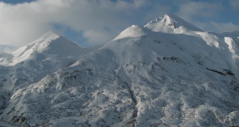 The mountain range is covered in snow