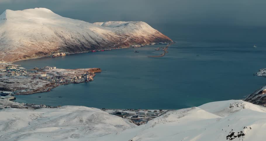 The shoreline is covered with snow and ice
