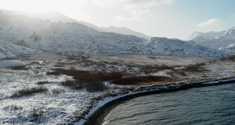 Looking down over the snow covered beach in the bright sun