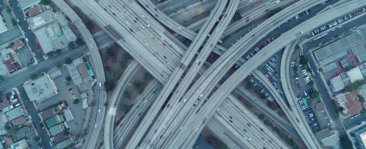 Cars drive on a city highway