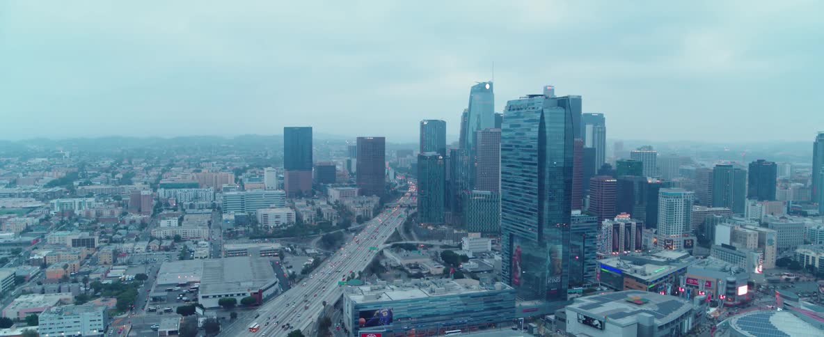 Cars travel on a highway through the city