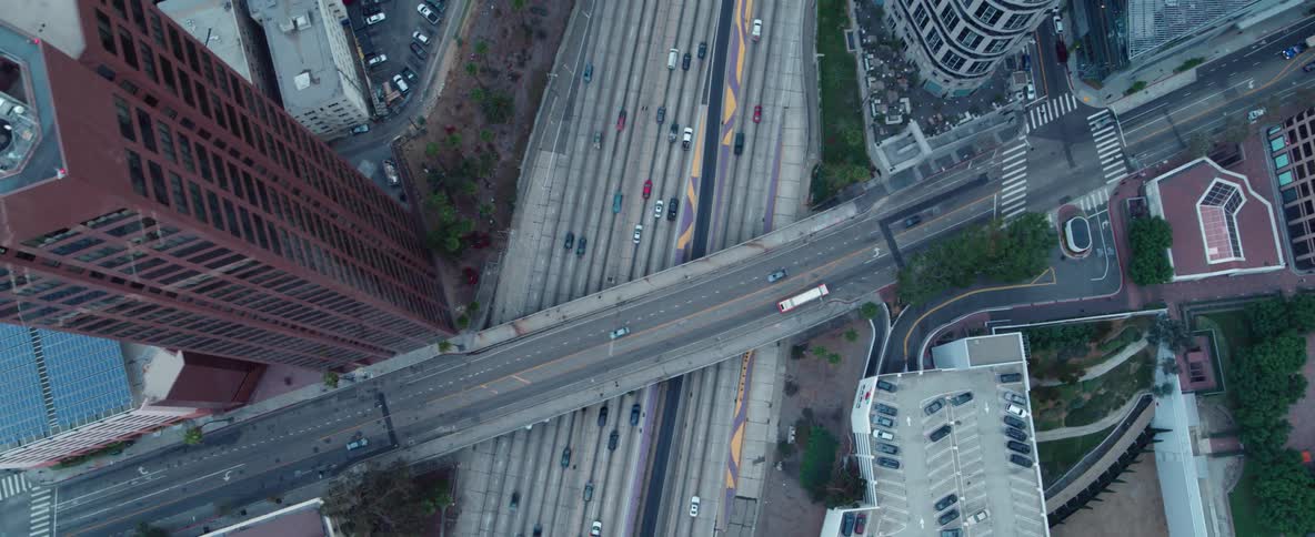 A drone is flying over a busy city