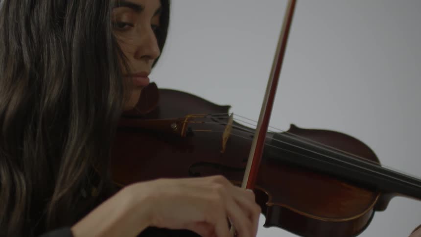 A woman plays a violin