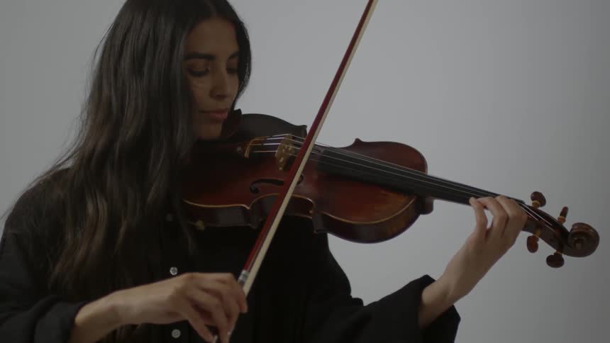 A woman plays a violin