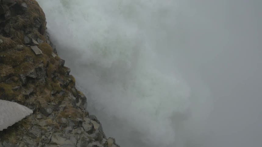 A waterfall rolling down a cliff side