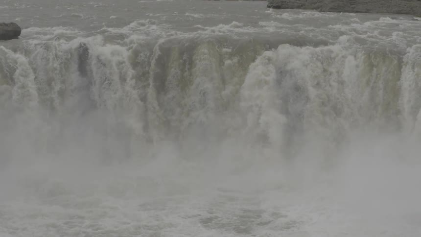 A waterfall rolling down a cliff side