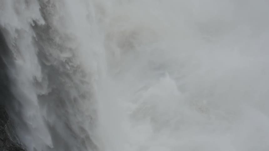 Water flowing down a large waterfall