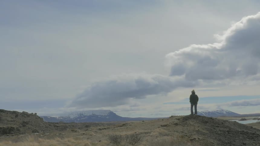 A person standing on a rock